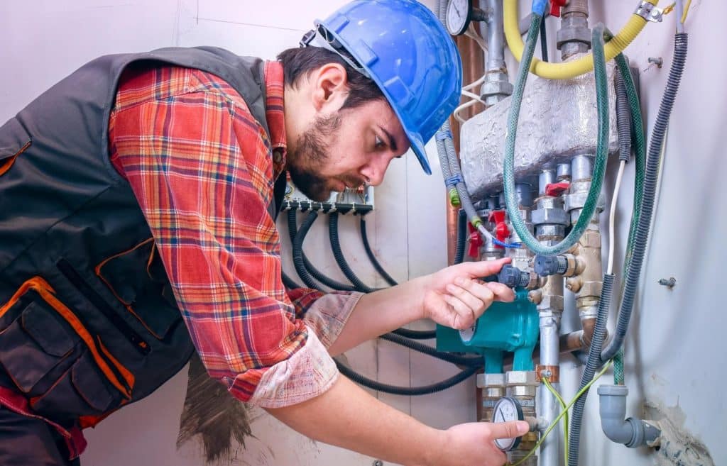 A commercial boiler owner carrying out maintenance checks