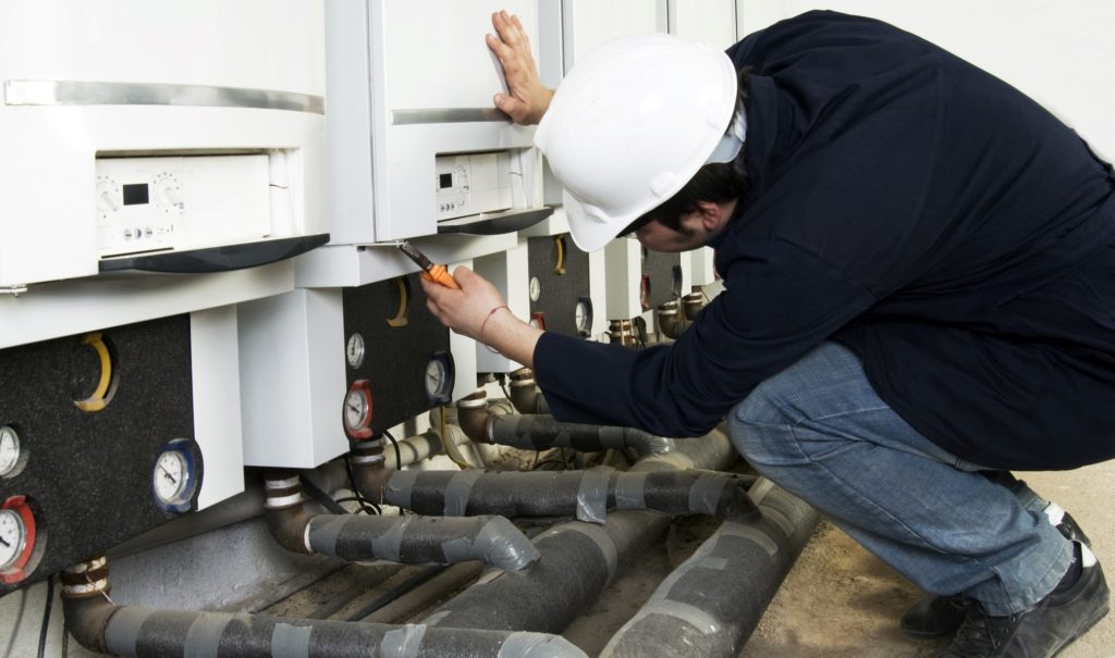 A man fixing his commercial boiler